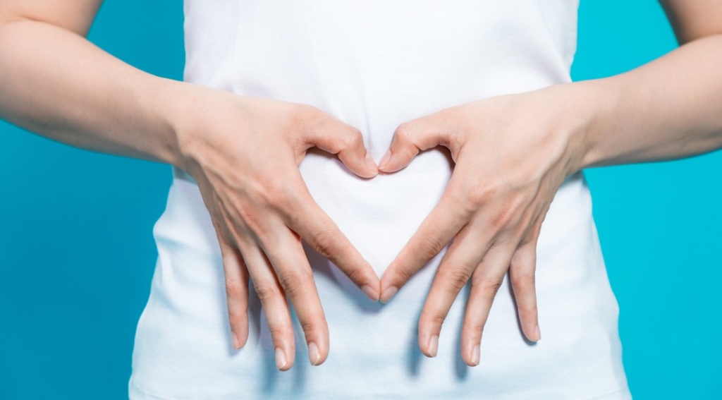 Fingers-Shaped-in-Heart-Over-Stomach.jpg